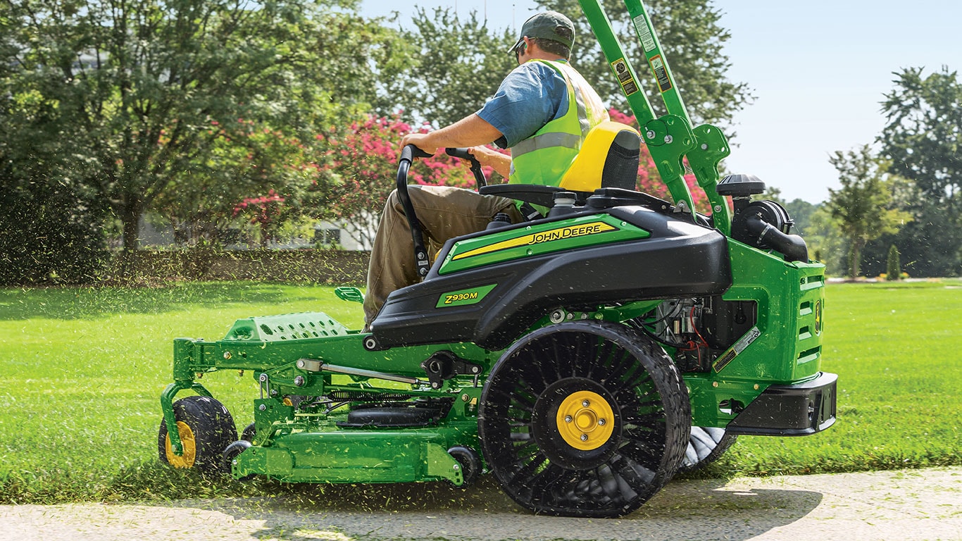 Professional landscaper on John Deere riding mower