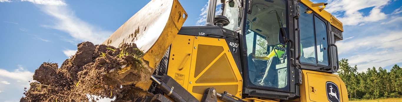 450 P-Tier dozer moving dirt on job site.