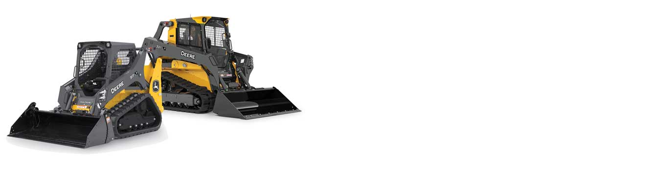 Two compact track loaders on white background