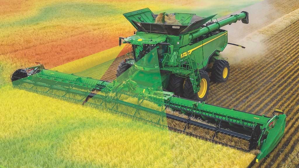 Photo of a X9 Combine harvesting wheat with a draper head, and a graphic that represents Predictive Ground Speed Automation
