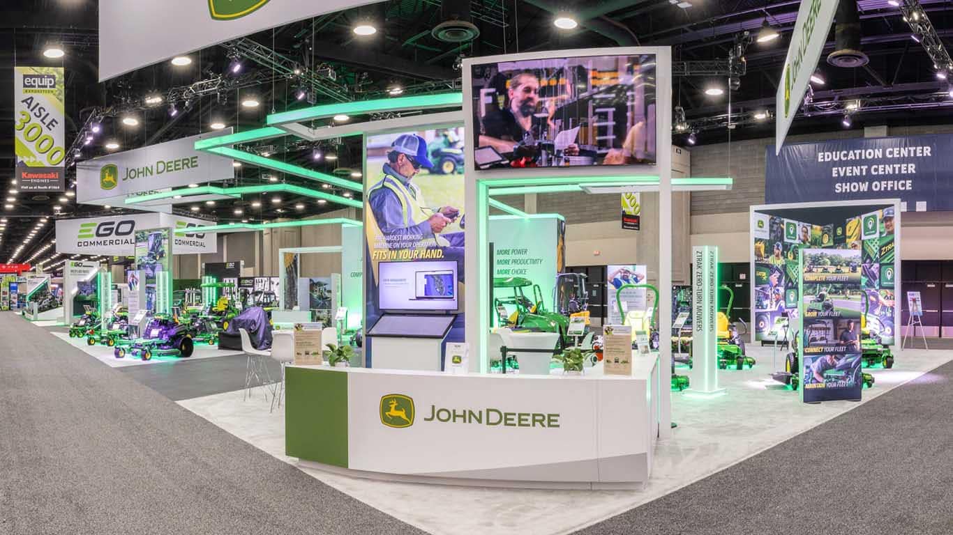A wide indoor shot of the Deere indoor booth centered on the front counter.