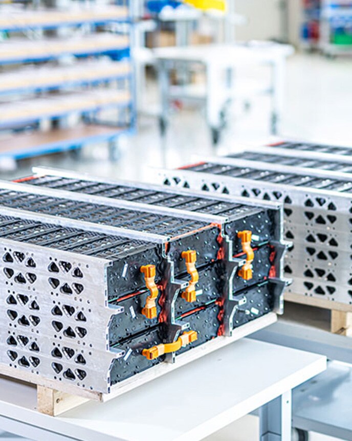 Kreisel battery packs laid out on a table at Kreisel’s production facility