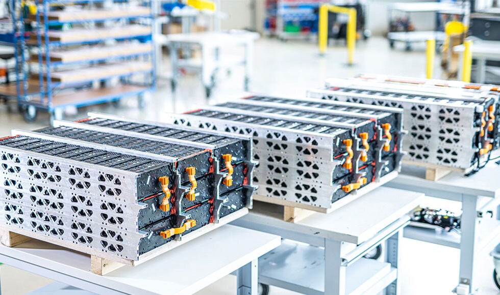 Kreisel battery packs laid out on a table at Kreisel’s production facility