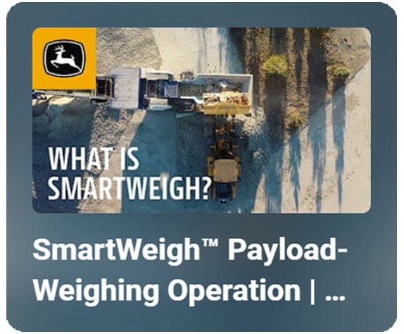 SmartWeigh™ Payload Weighing Operation: A sky view of a John Deere Wheel Loader dumping a bucket of aggregate into a crusher.