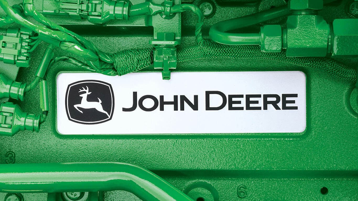 Close-up photo of green John Deere machinery with a branded nameplate reading 'John Deere.'