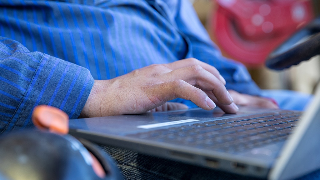 Image of a man on a laptop