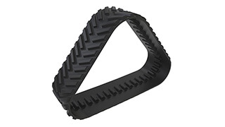 A rubber track segment for heavy equipment.