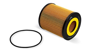 A cylindrical engine air filter with a rubber gasket.