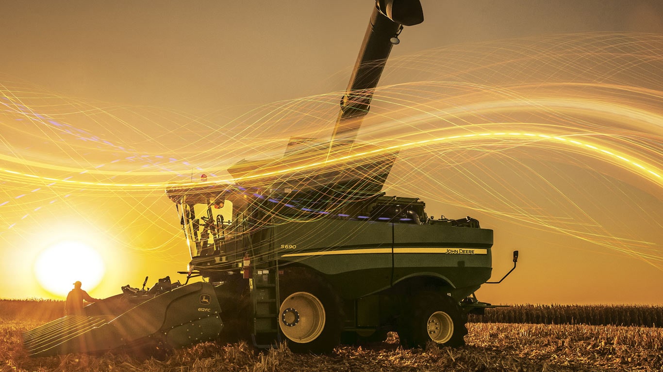 composite image of farm equip during at sunset/sunrise