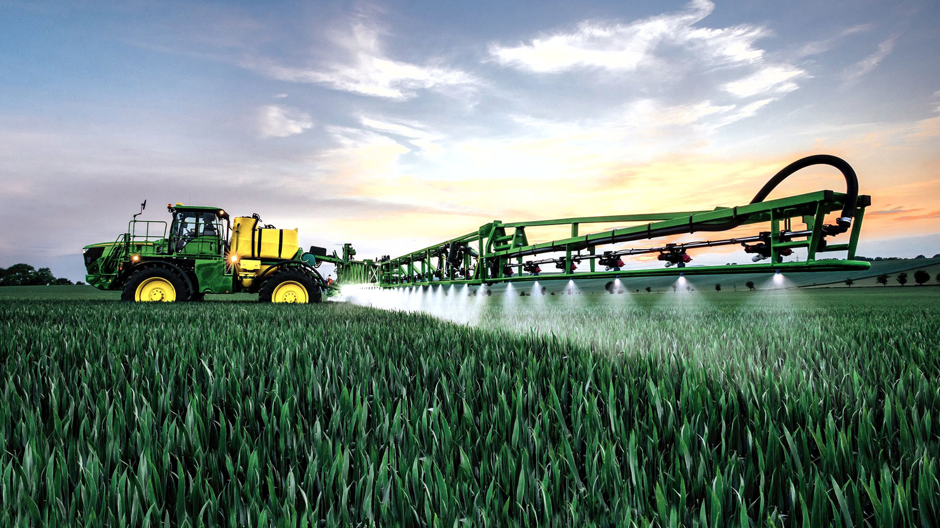 image of sprayer in crop field