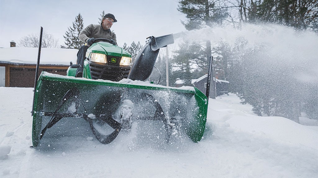 https://www.deere.com/assets/images/region-4/products/attachments/attachments-and-implements/utiilty-tractor-attachments-accessories/snow-removal/lawn-tractor-snow-blower-1024x576.jpg