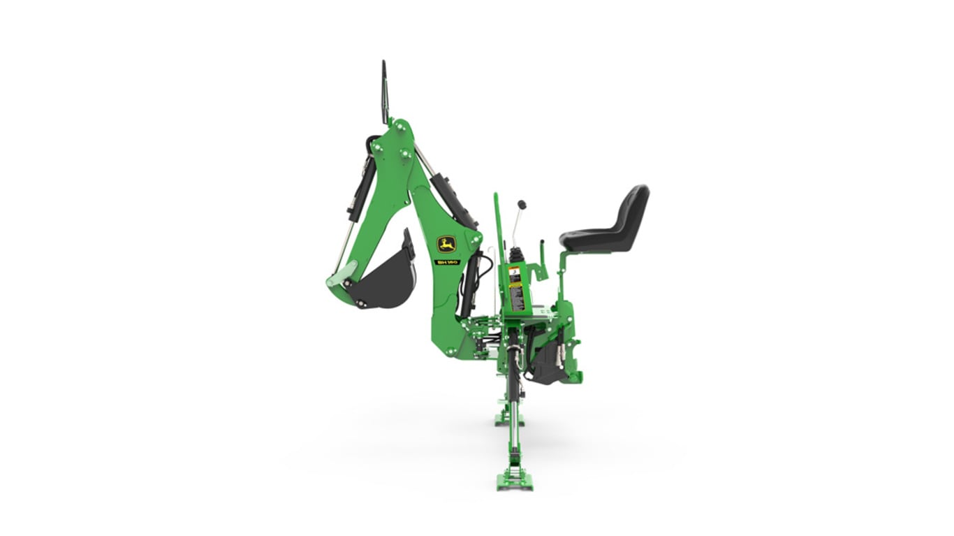 A left-facing studio shot of a green backhoe implement on a white background.