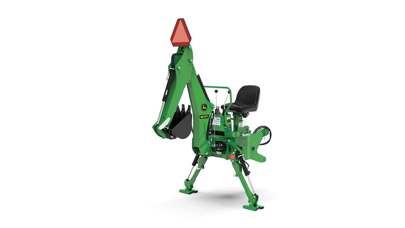 A front-left-facing studio shot of a green backhoe implement on a white background.