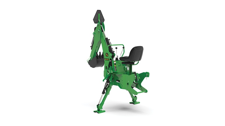 A rear-left-facing studio shot of a green backhoe implement on a white background.