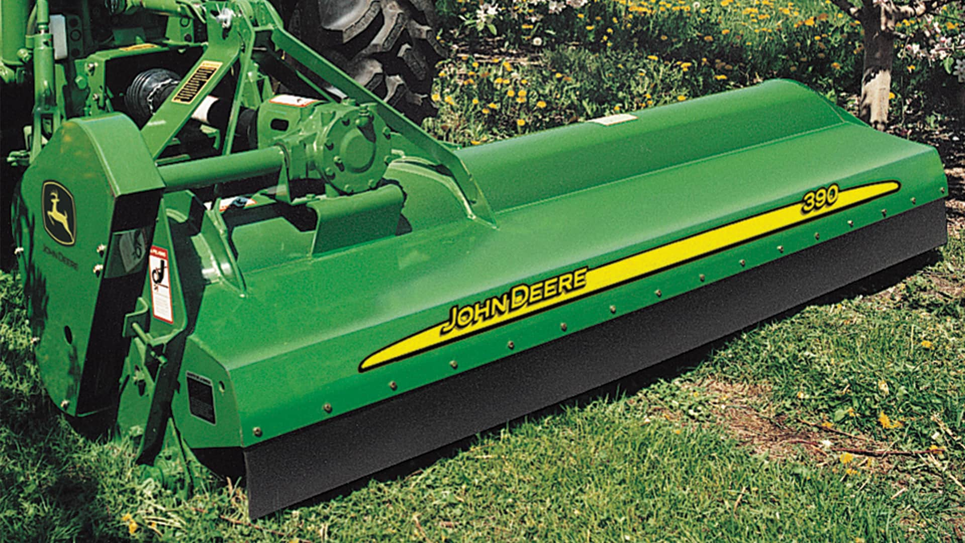 JD Flail Mower attached to tractor in field