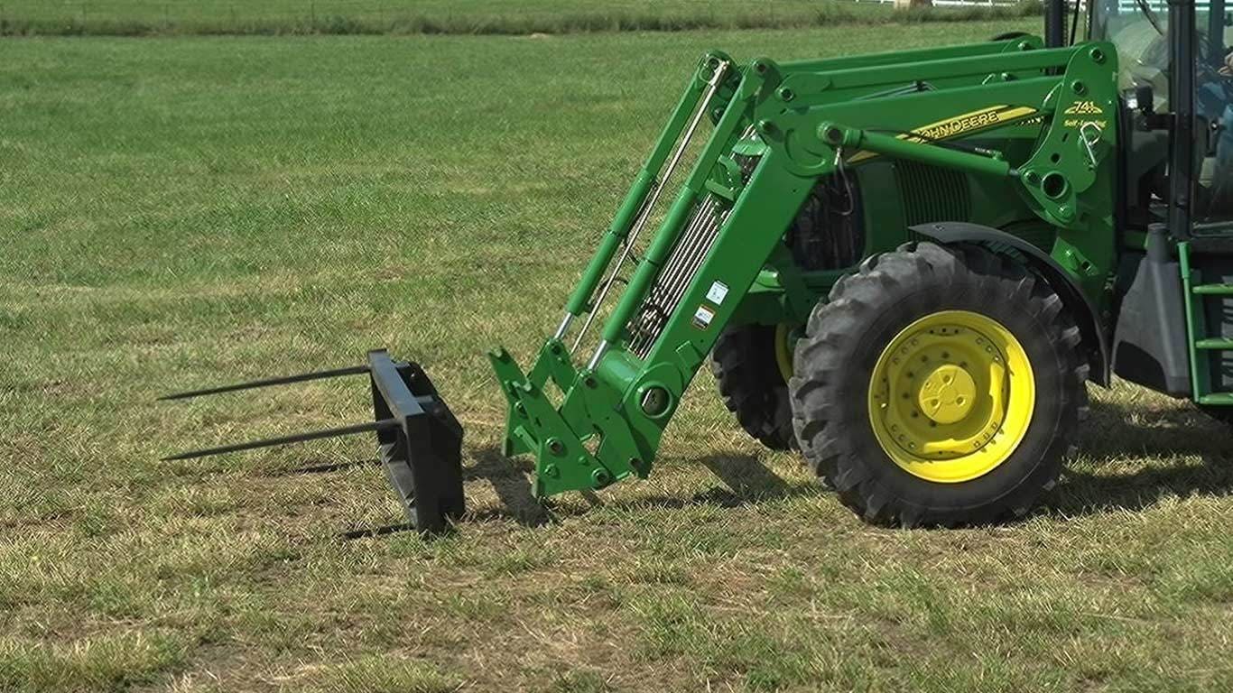 field image of ab14 bale spear on tractor in field