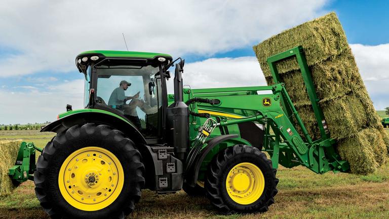 image of ab18 series bale spear on tractor in field
