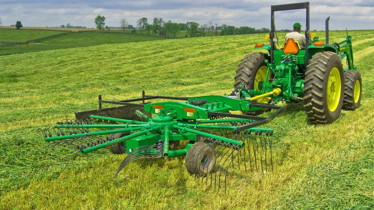 field image of Frontier rr22 rotary rake attached to a tractor