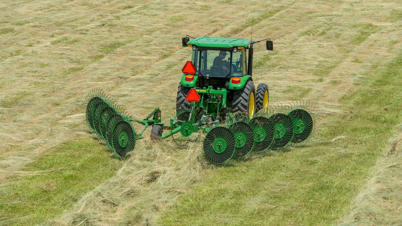 field image of Frontier™ WR00 wheel rake attached to a tractor