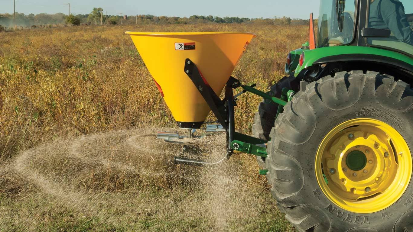 image of Frontier sb30b broadcast spreader on tractor in field