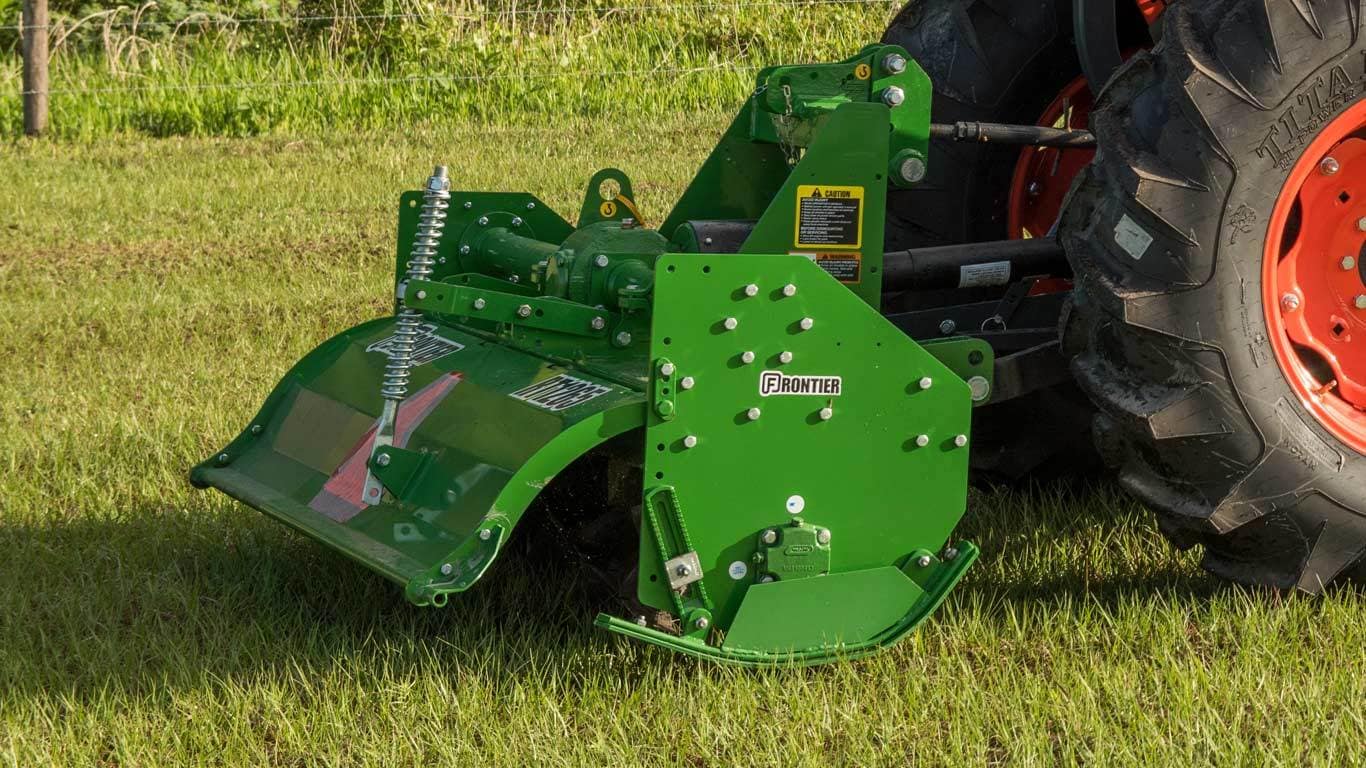 field image of a Frontier RT12 series rotary tiller on the back of a tractor