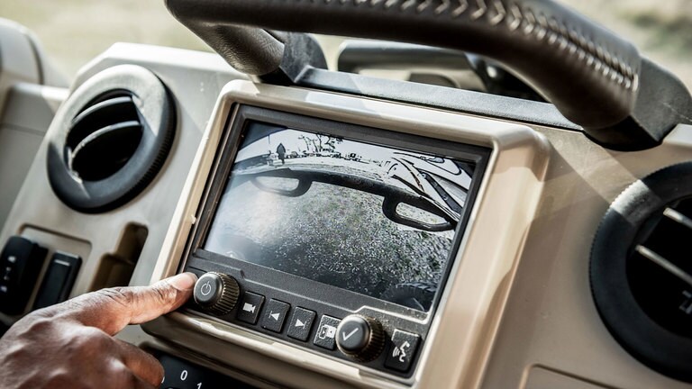 Closeup photo of rear view camera being displayed on screen.