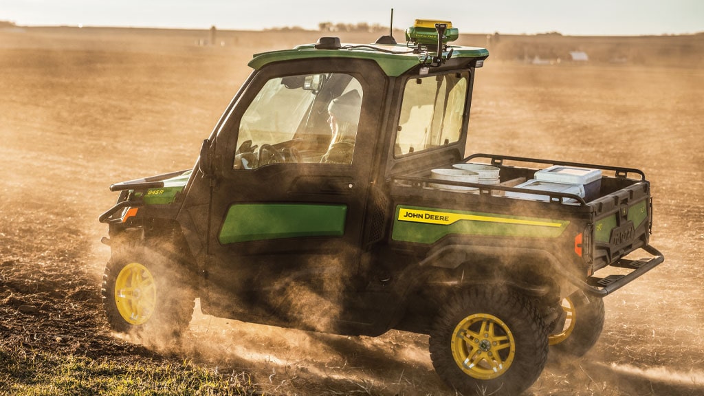 XUV 845R driving through field
