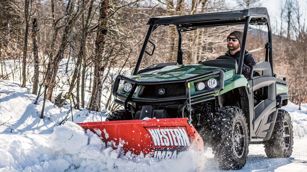 2024 Gator XUV590M using a shovel to plow through tall snow