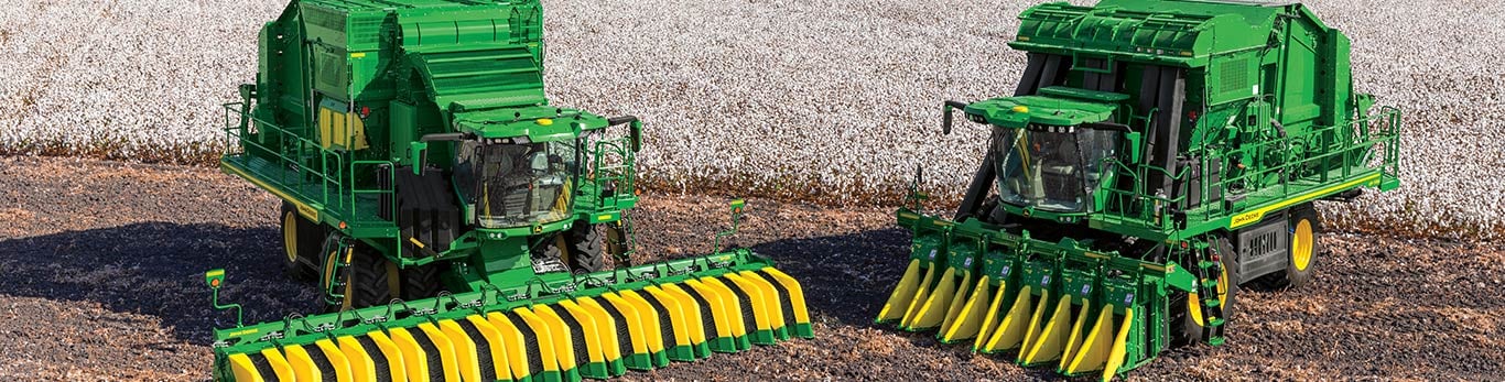 Cotton picker and stripper in cotton field