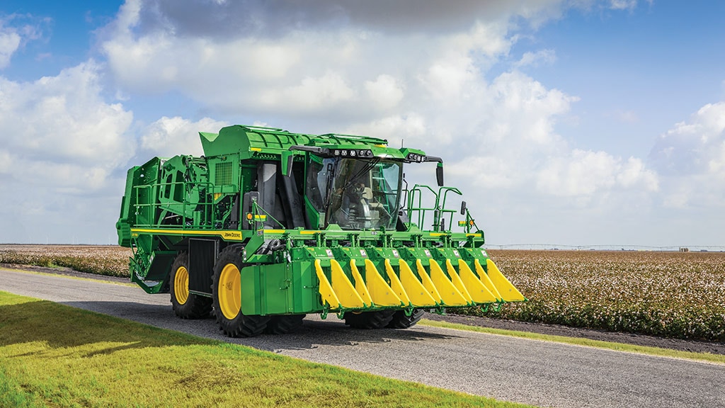 Harvester driving down the road