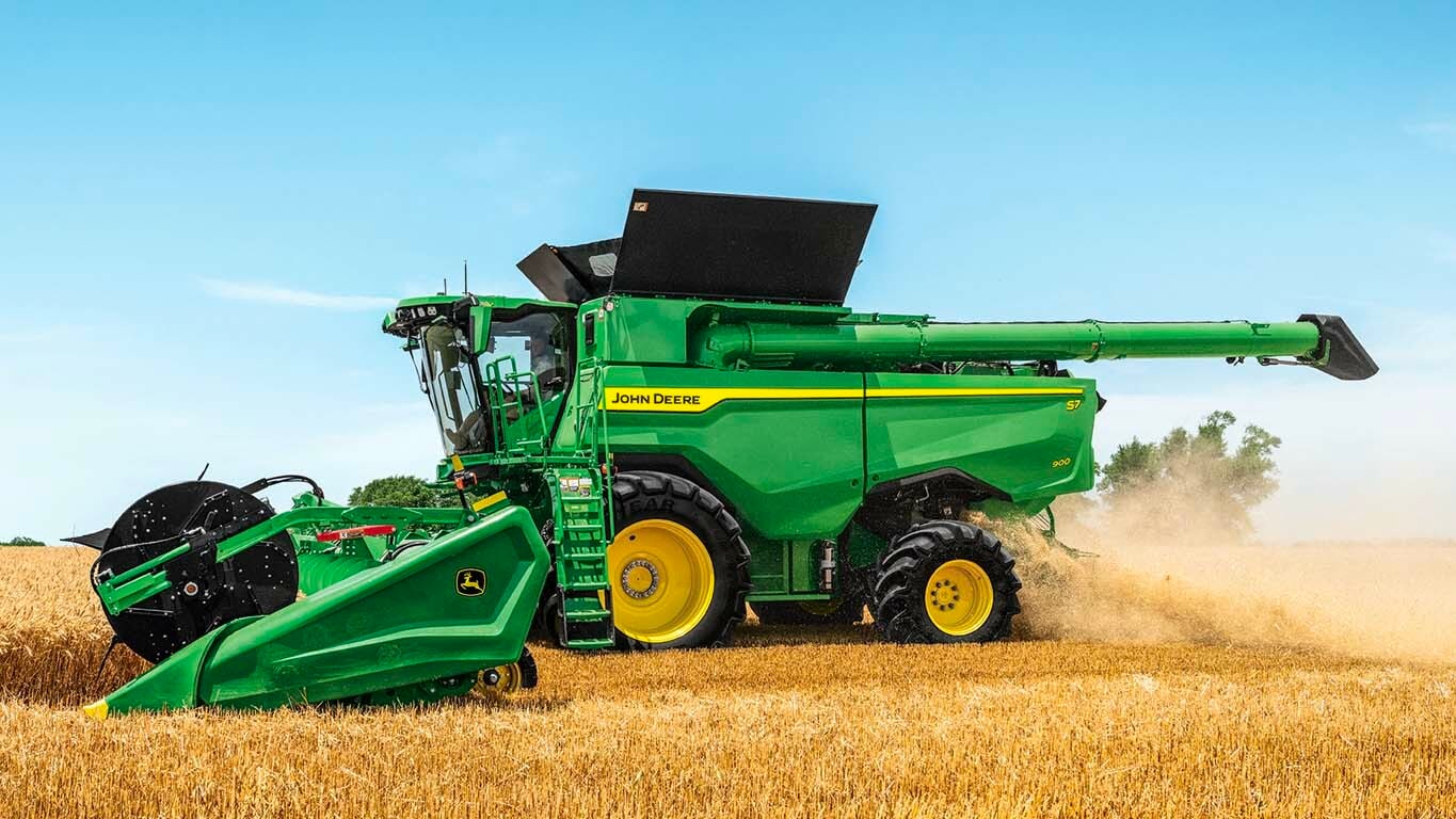 Side view of S7 900 combine harvesting wheat