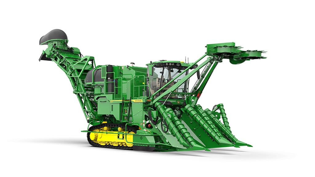 A studio photo of a CH950 Sugar Cane Harvester with tracks on a white, seamless setting.