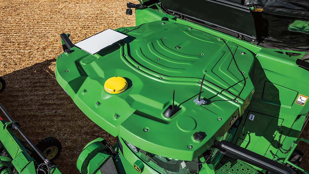 Overhead photo showing an integrated StarFire Receiver and JDLink Boost on the cab roof of a CH Series Sugar Cane Harvester.