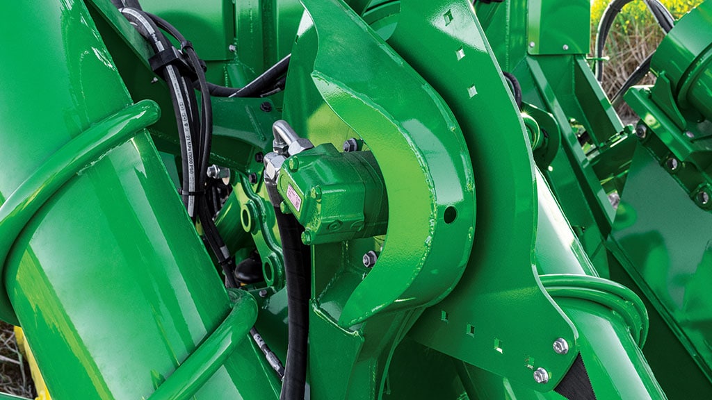 Close-up photo showing the adjustable side knives on a CH Series Sugar Harvester.
