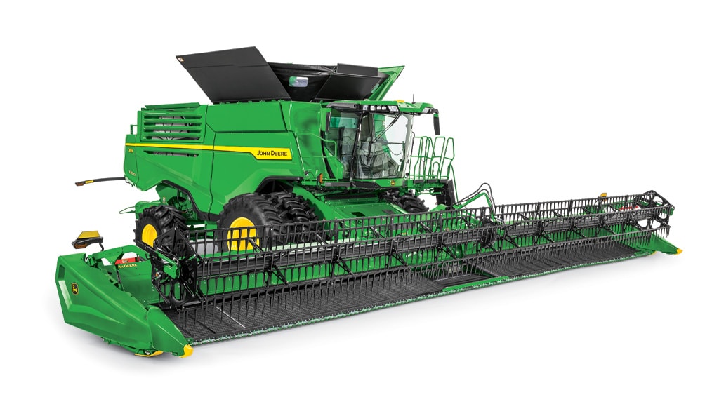Photo of a John Deere X9 1100 Combine with a draper head, on a white background