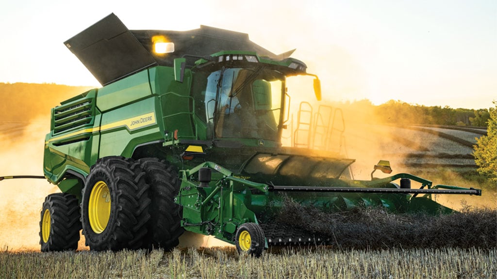 Photo of a John Deere Belt Pickup header on a John Deere Combine