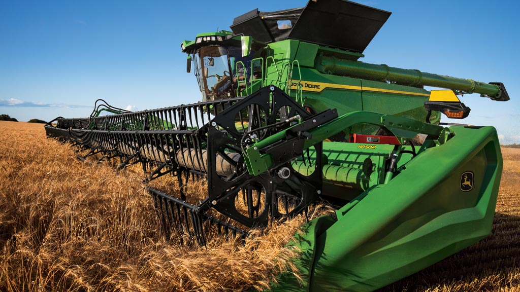 Photo of a John Deere draper harvesting small grains