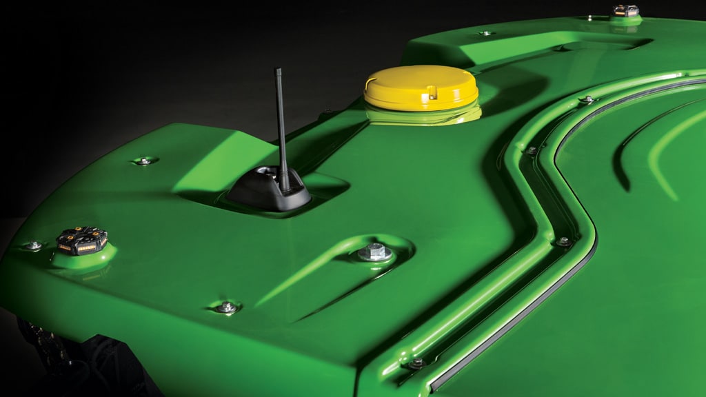 Photo of the integrated StarFire™ Receiver mounted on the cab of a John Deere X9 Combine
