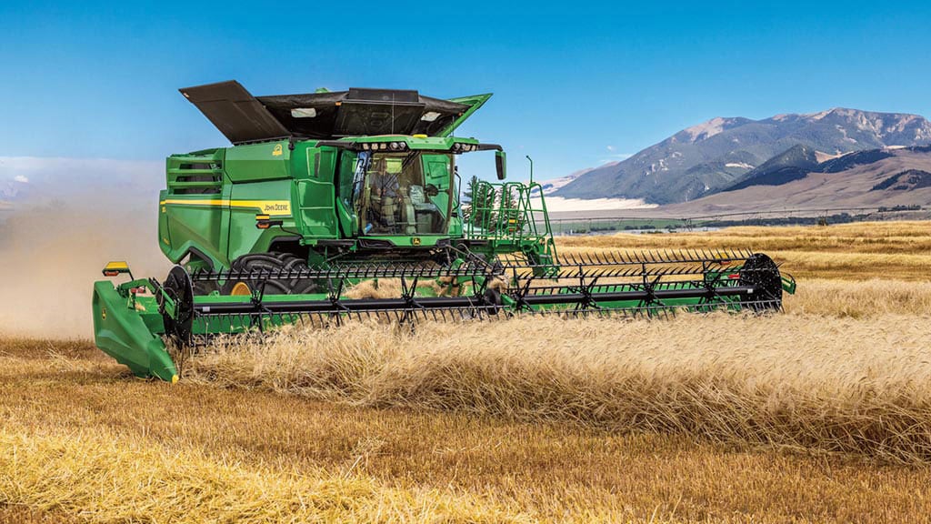 Photo of a John Deere draper harvesting small grains