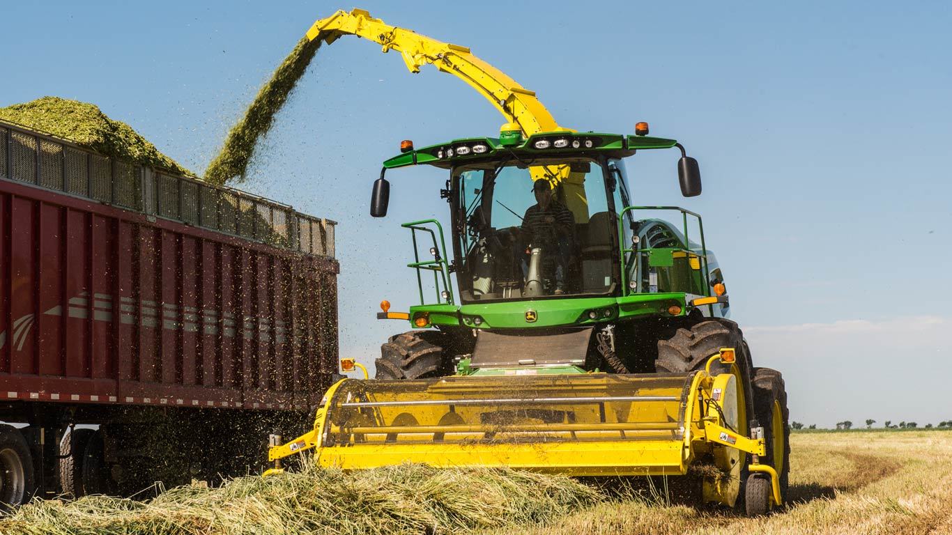 659 hay pickup dumping hay into a bin