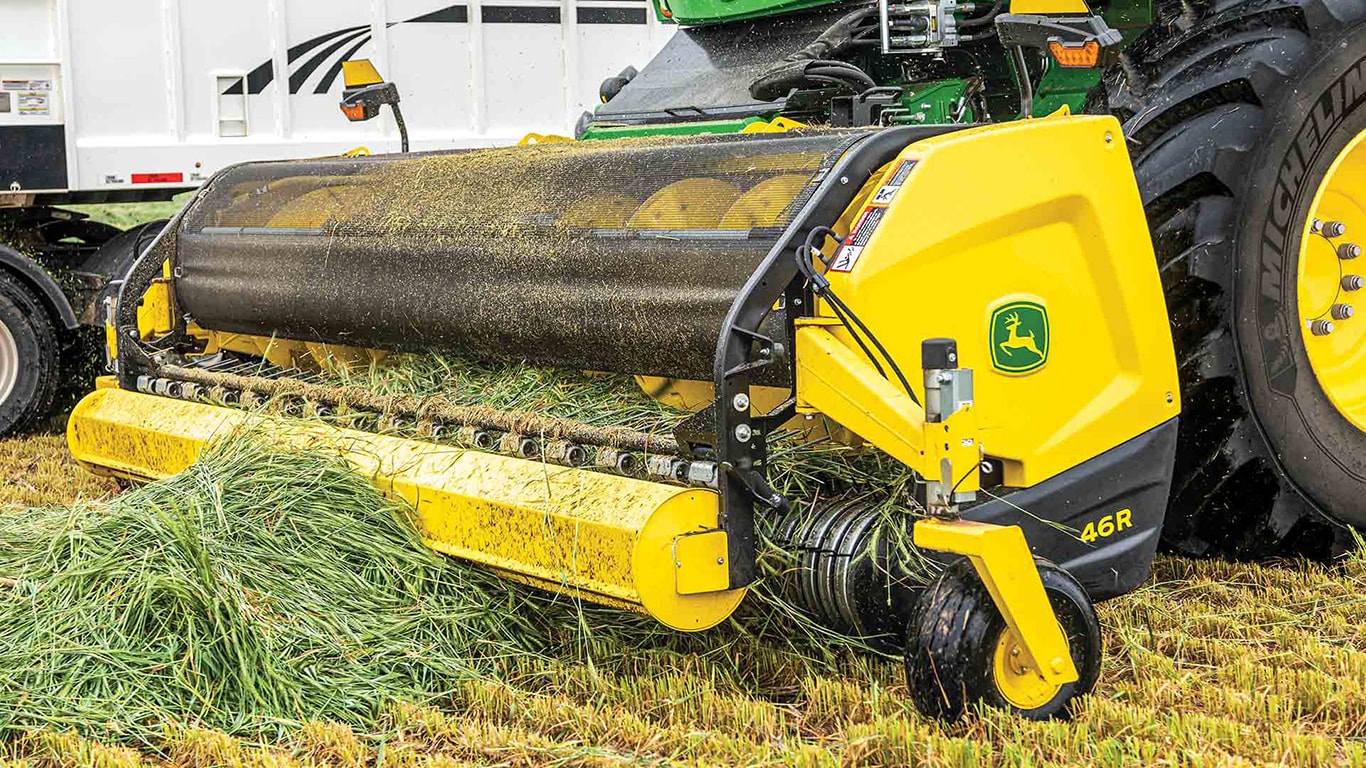 Close up of a 46R header picking up hay