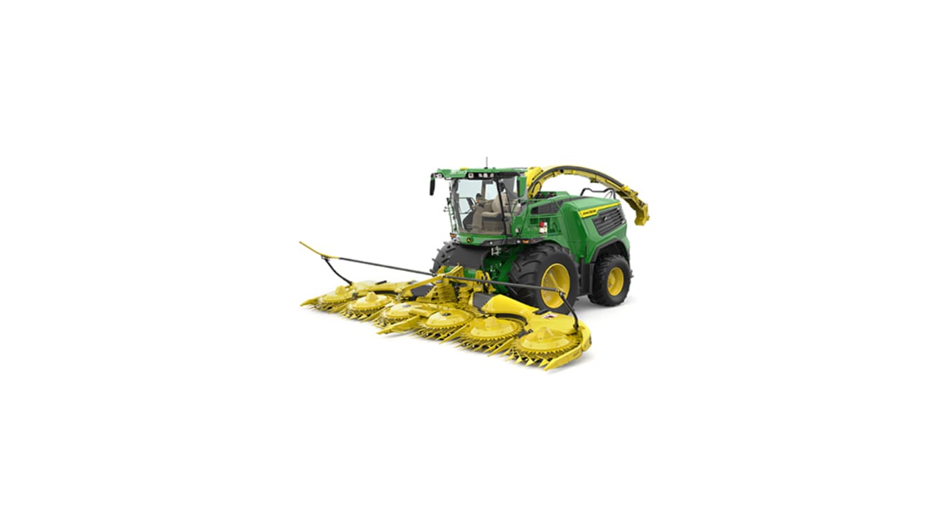 A front-left-facing green F9 1000 self-propelled forage harvester with a yellow header on a white background.