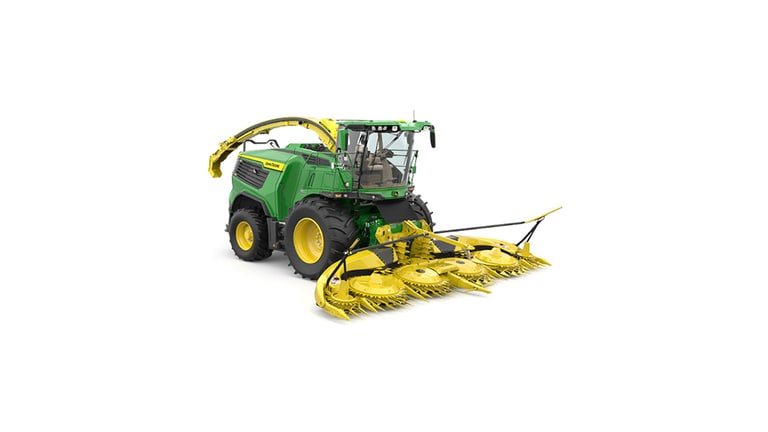 A front-right-facing green F9 500 self-propelled forage harvester with a yellow header on a white background.