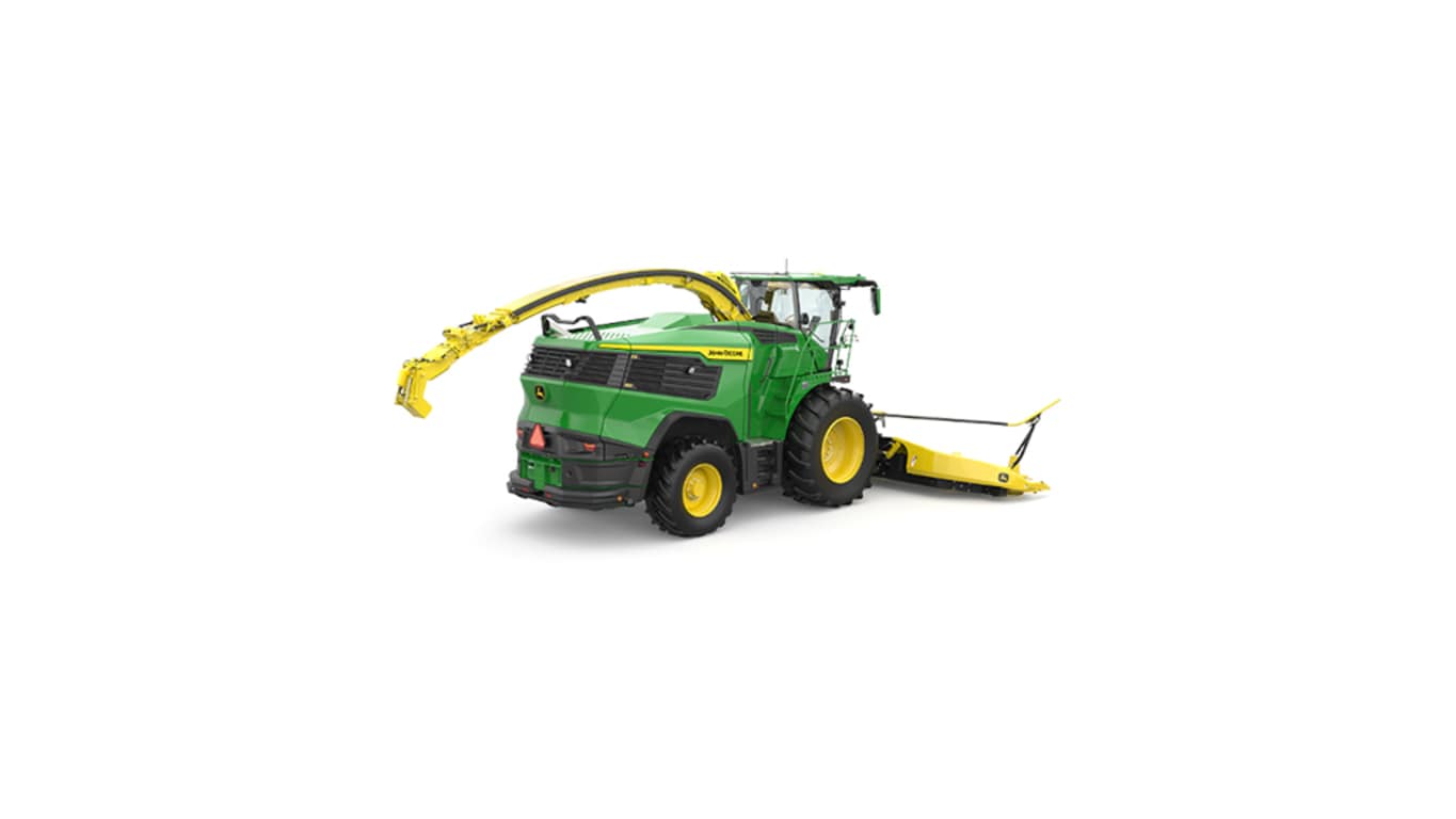 A rear-right-facing green F9 500 self-propelled forage harvester with a yellow header on a white background.