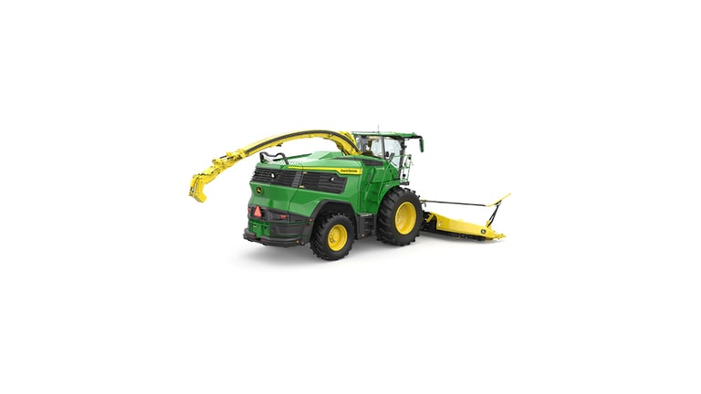 A rear-right-facing green F9 600 self-propelled forage harvester with a yellow header on a white background.