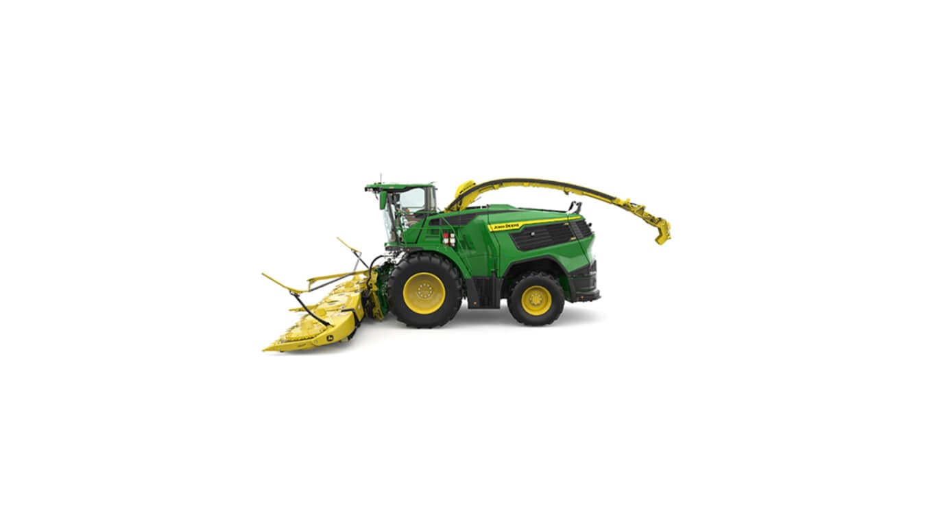A left-facing green F9 700 self-propelled forage harvester with a yellow header on a white background.