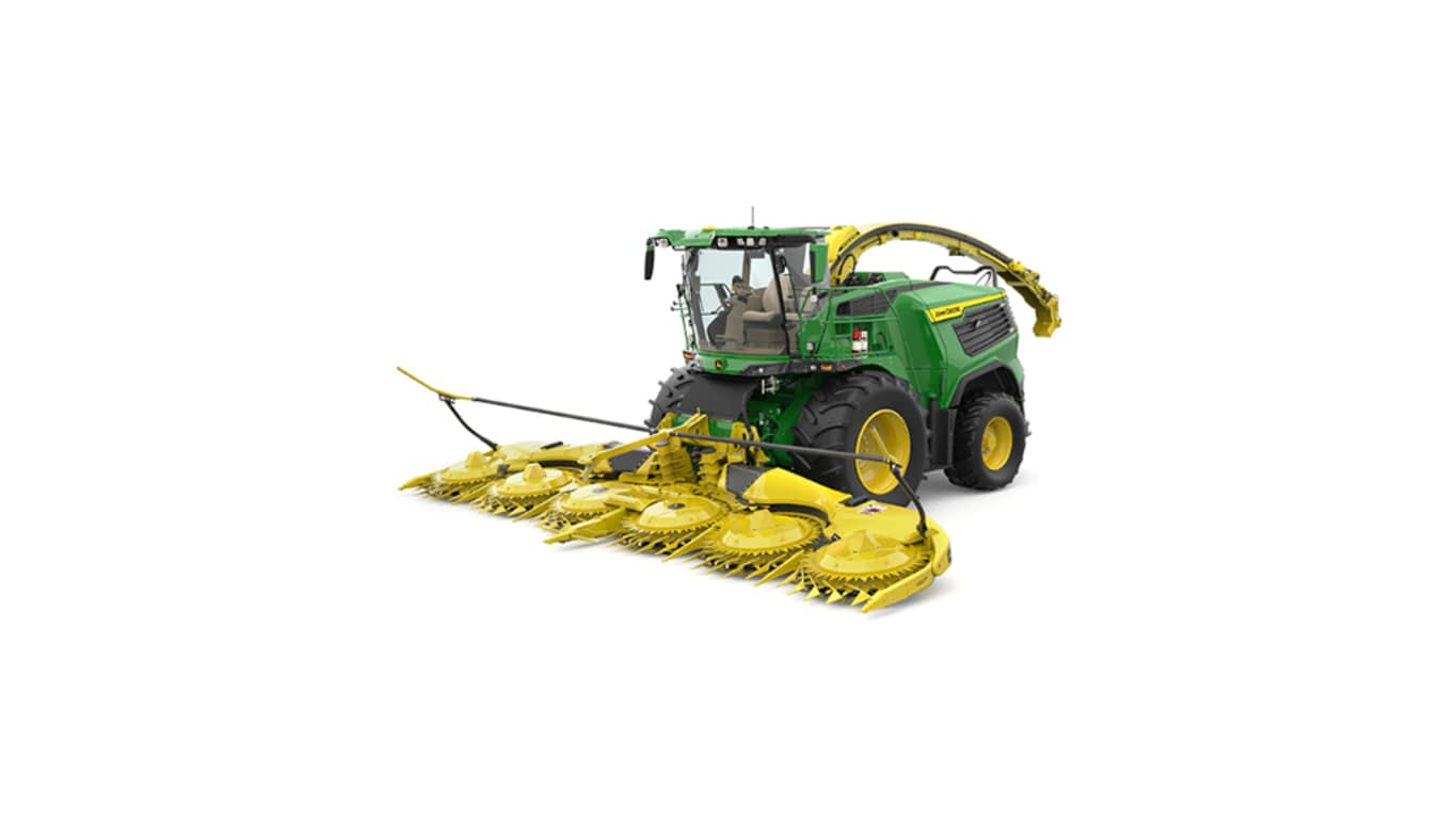 A front-left-facing green F9 900 self-propelled forage harvester with a yellow header on a white background.