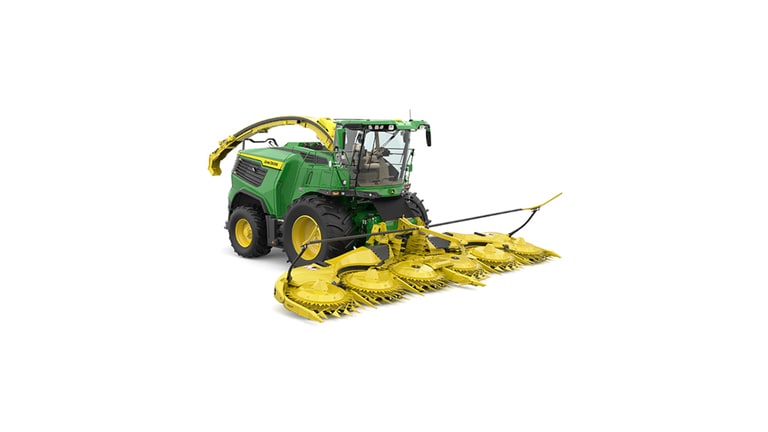 A front-right-facing green F9 900 self-propelled forage harvester with a yellow header on a white background.