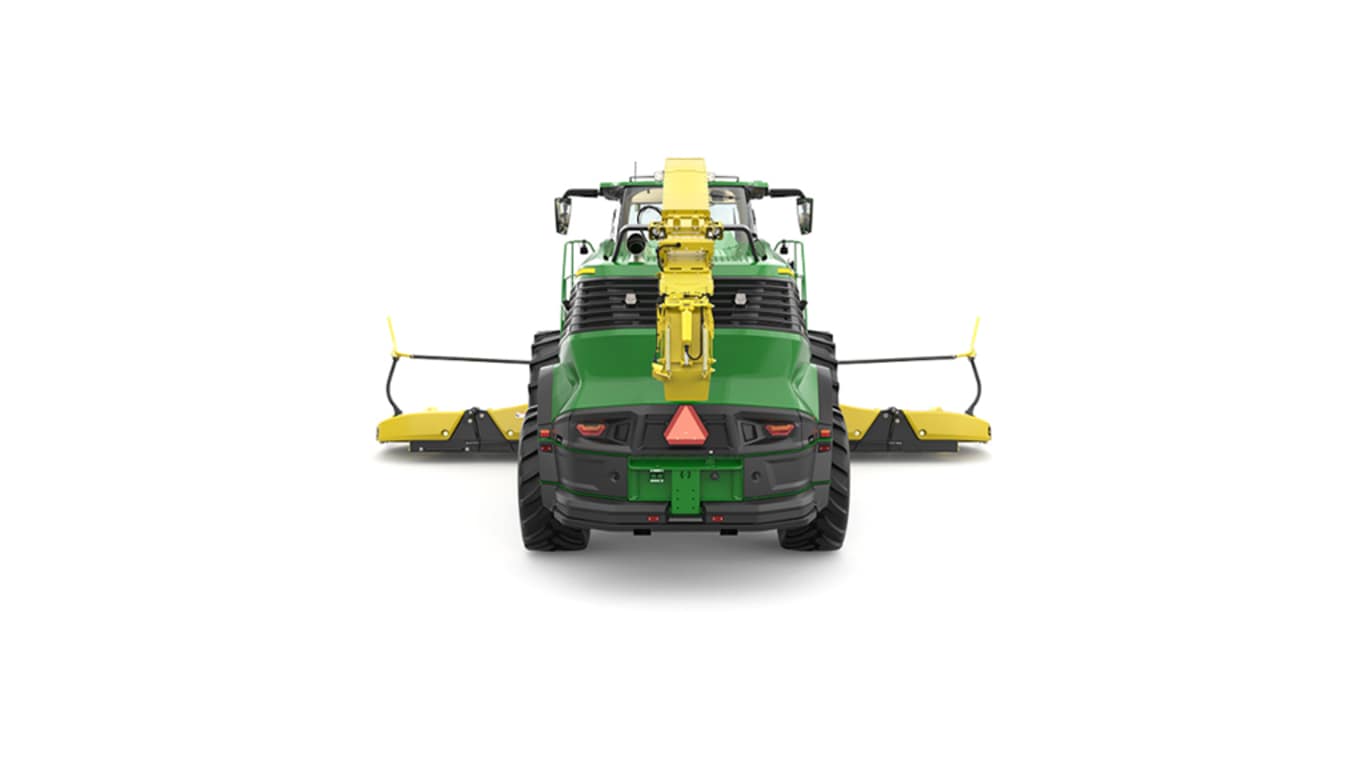 A rear-facing green F9 900 self-propelled forage harvester with a yellow header on a white background.