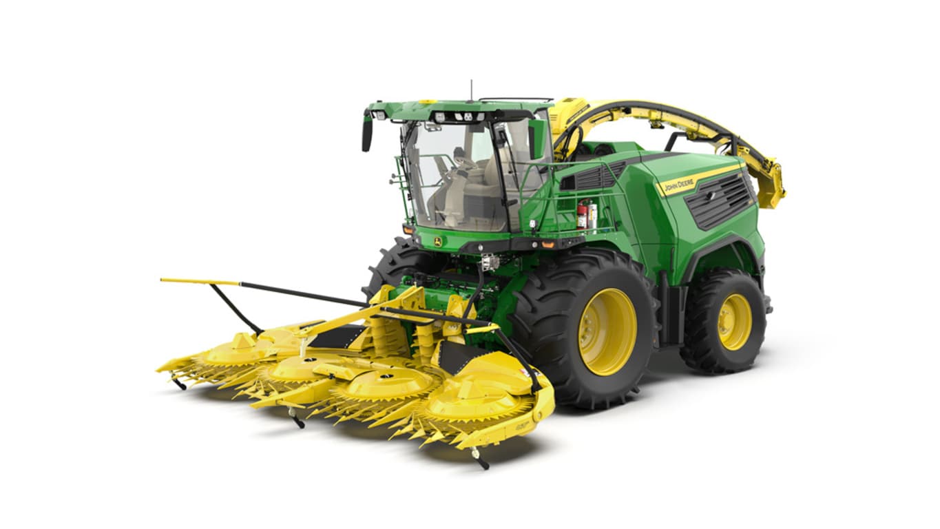 A front-left-facing green F8 500 self-propelled forage harvester with a yellow header on a white background.